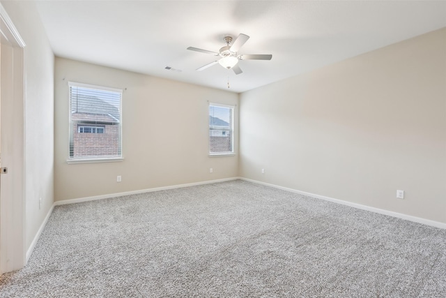 unfurnished room featuring ceiling fan and carpet flooring