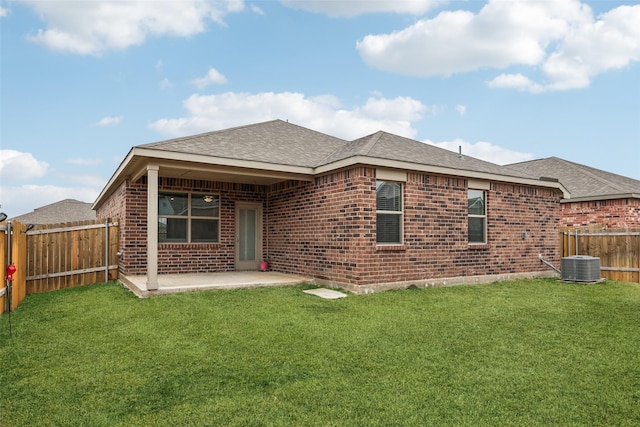 back of house with a patio, central AC, and a lawn