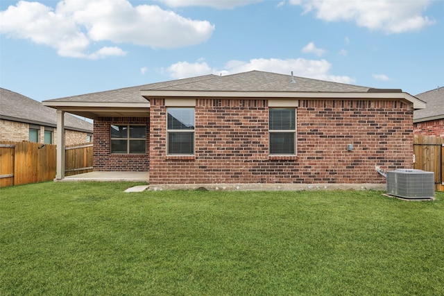 back of house with a yard, central AC unit, and a patio