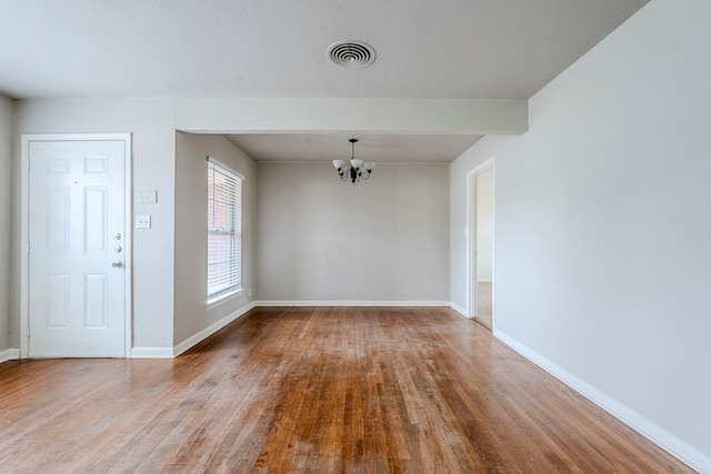 interior space with light wood-type flooring and a chandelier