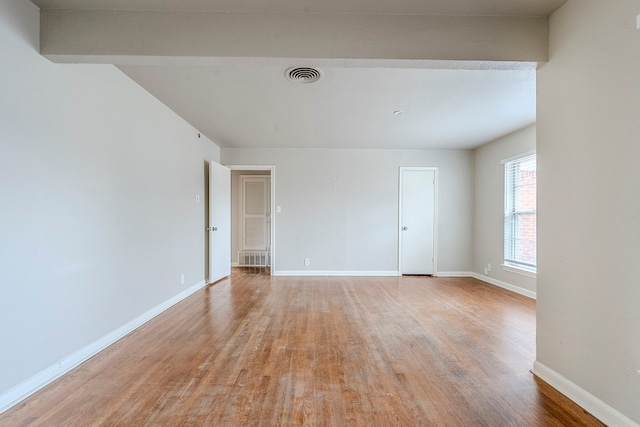 empty room with light hardwood / wood-style floors