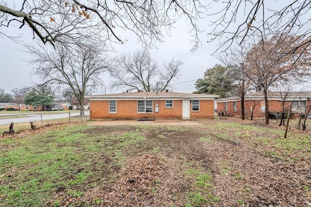 back of property with a patio