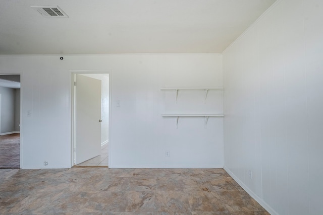 spare room with crown molding