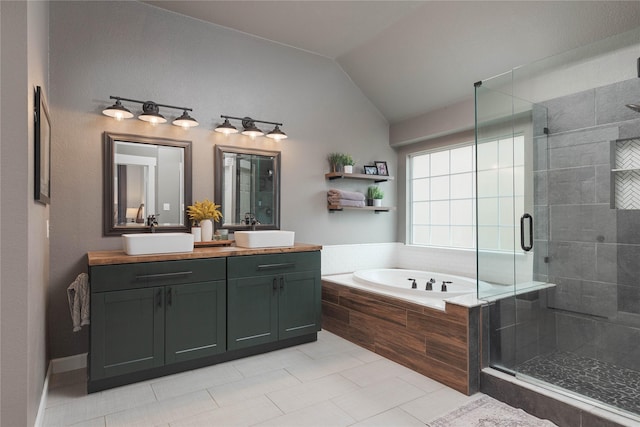 bathroom with tile patterned floors, vanity, plus walk in shower, and vaulted ceiling