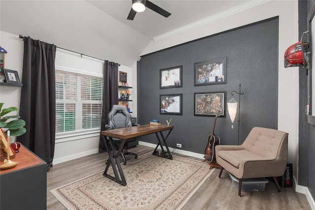 office featuring ceiling fan, lofted ceiling, wood-type flooring, and ornamental molding