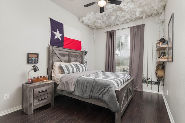 bedroom with dark wood-type flooring and ceiling fan