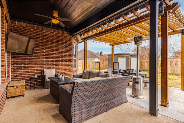 view of patio / terrace featuring a pergola, an outdoor hangout area, and a storage unit