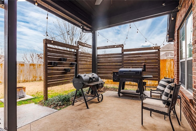 view of patio featuring a grill