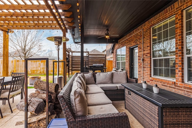 view of patio featuring a jacuzzi, outdoor lounge area, and a pergola