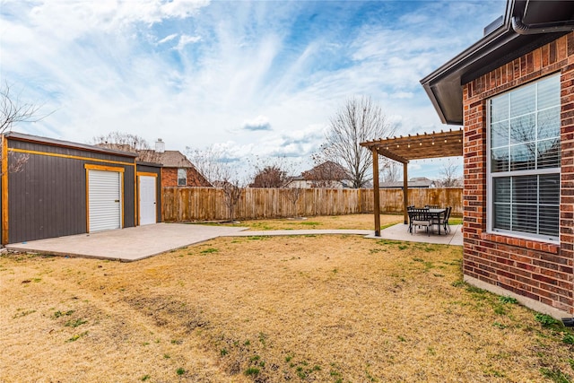 view of yard with a pergola and a patio