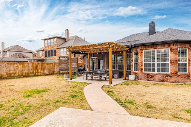 back of house featuring a pergola and a patio area