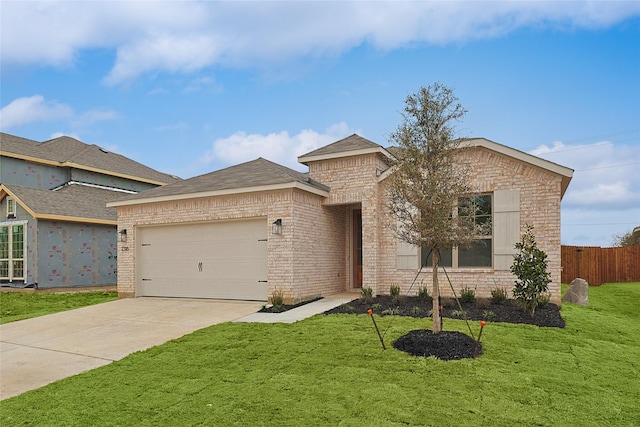 view of front facade with a garage and a front lawn