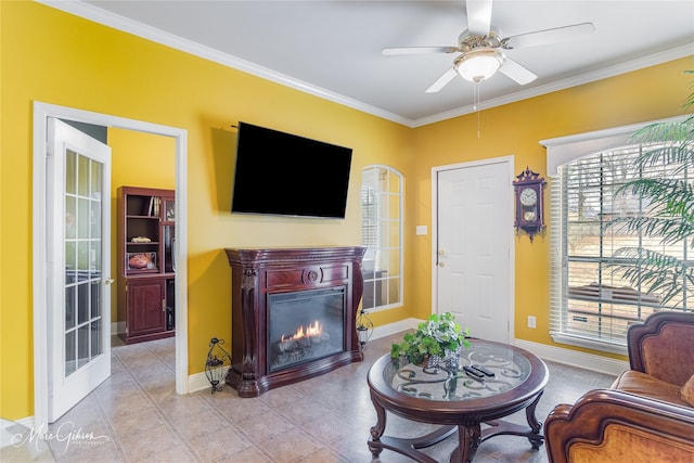 tiled living room featuring ceiling fan and ornamental molding