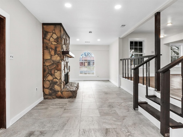 unfurnished living room with a fireplace