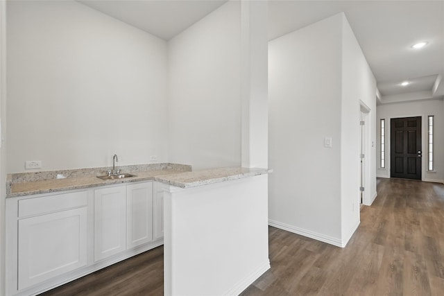 16109 Garden Dr, Celina, TX 75009 - kitchen featuring white cabinets, baseboards, a sink, and dark wood finished floors