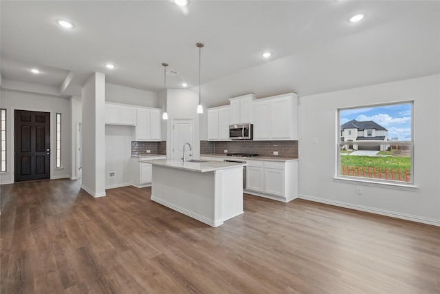 16109 Garden Dr, Celina, TX 75009 - kitchen featuring white cabinetry, a sink, backsplash, and appliances with stainless steel finishes