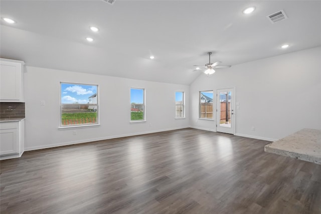 16109 Garden Dr, Celina, TX 75009 - unfurnished living room featuring dark wood-type flooring, a ceiling fan, visible vents, vaulted ceiling, and baseboards
