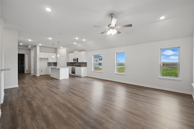 16109 Garden Dr, Celina, TX 75009 - unfurnished living room with recessed lighting, dark wood-style flooring, and a ceiling fan