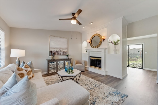 living room featuring hardwood / wood-style floors, plenty of natural light, and ceiling fan