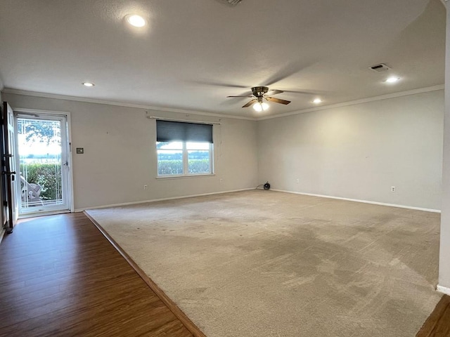 empty room with ornamental molding, recessed lighting, visible vents, and baseboards