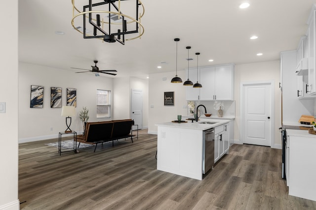 kitchen featuring sink, an island with sink, hanging light fixtures, and white cabinets