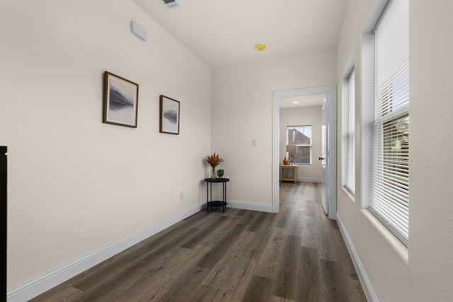 hall featuring dark wood-type flooring