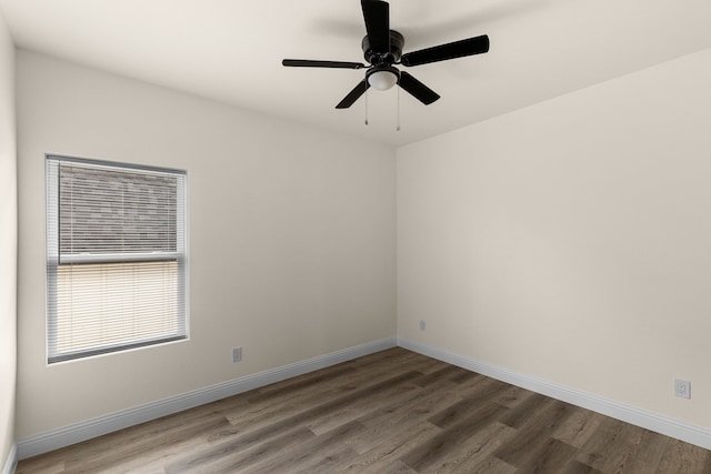 empty room featuring hardwood / wood-style floors and ceiling fan