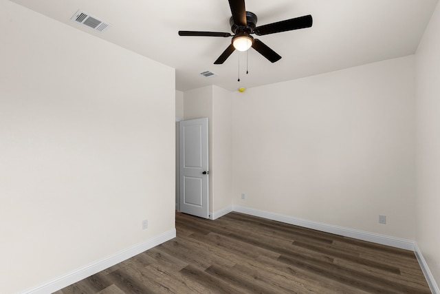 empty room featuring dark hardwood / wood-style floors and ceiling fan