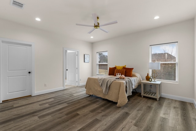 bedroom featuring ceiling fan and dark hardwood / wood-style flooring