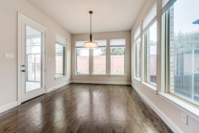 unfurnished sunroom featuring a wealth of natural light