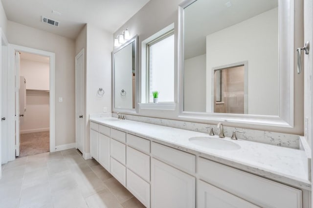 bathroom with vanity and tile patterned floors