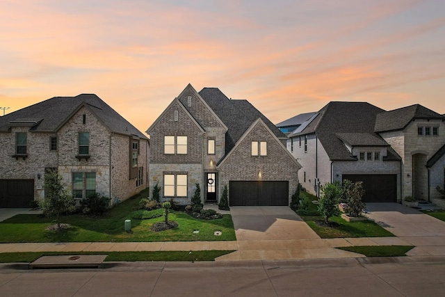 french country home with a garage