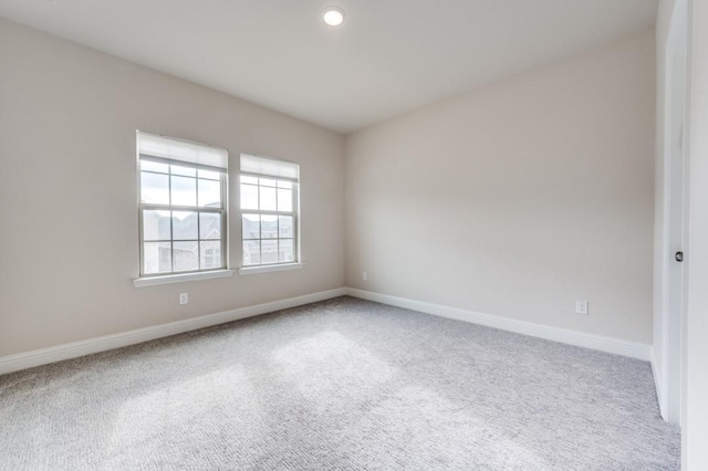 empty room with carpet flooring