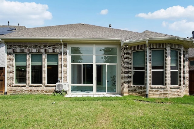 rear view of house with a yard