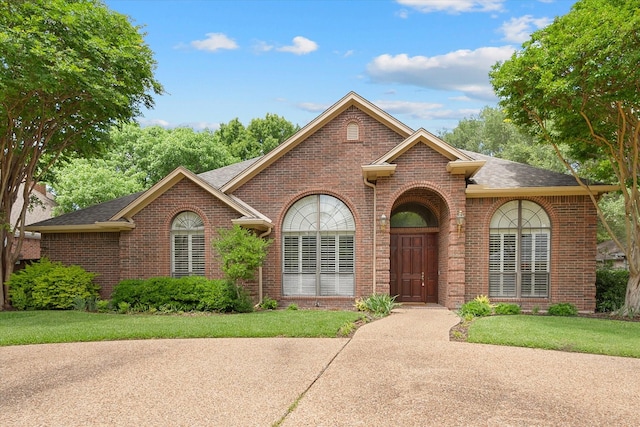 1604 Bridle Path, Corsicana, TX 75110 - view of front facade featuring brick siding and roof with shingles