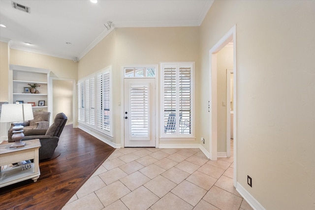 1604 Bridle Path, Corsicana, TX 75110 - unfurnished room with a chandelier, dark wood-style flooring, baseboards, and crown molding