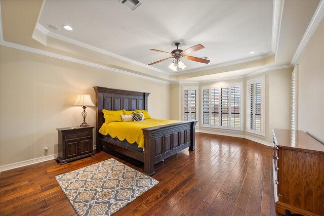 1604 Bridle Path, Corsicana, TX 75110 - bedroom featuring a tray ceiling, dark wood-style flooring, baseboards, crown molding, and recessed lighting