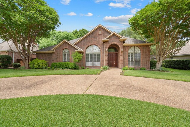 1604 Bridle Path, Corsicana, TX 75110 - view of front of property featuring brick siding and a shingled roof