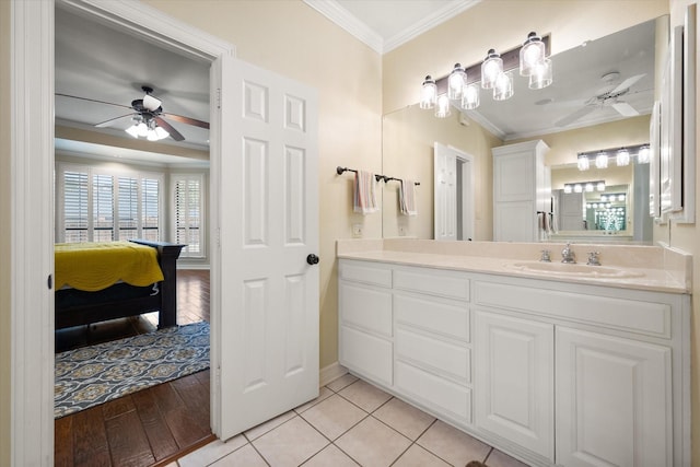 bathroom featuring vanity, hardwood / wood-style floors, crown molding, and ceiling fan