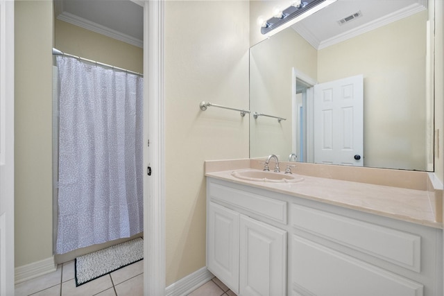 bathroom with ornamental molding, tile patterned flooring, and vanity