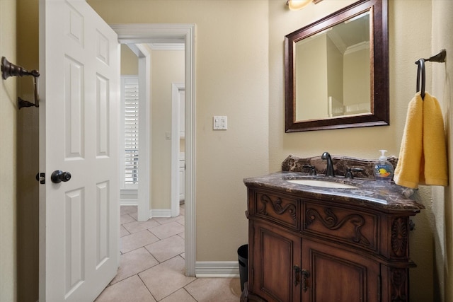 bathroom featuring crown molding, vanity, and tile patterned flooring