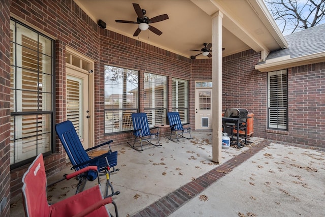 view of patio with grilling area and ceiling fan