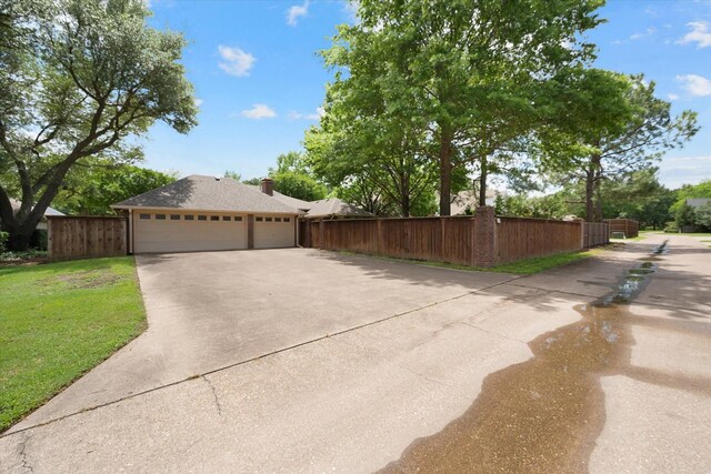 1604 Bridle Path, Corsicana, TX 75110 - view of home's exterior with concrete driveway and a garage