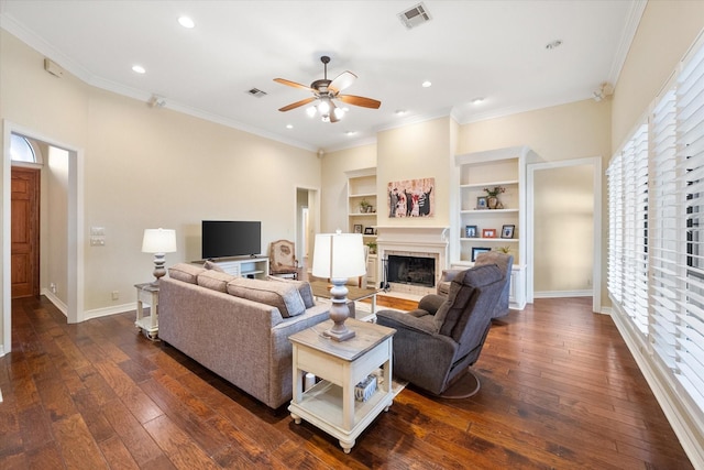 1604 Bridle Path, Corsicana, TX 75110 - living room with healthy amount of natural light, ceiling fan, recessed lighting, a fireplace, and dark wood-style floors