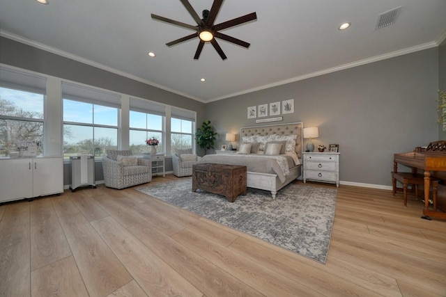 bedroom featuring light hardwood / wood-style flooring, ornamental molding, and ceiling fan