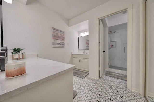 bathroom featuring vanity and an enclosed shower