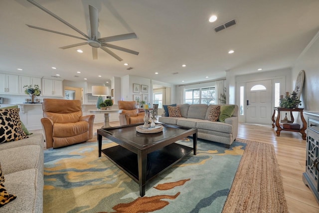 living room with light hardwood / wood-style flooring