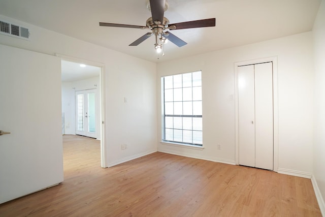 unfurnished bedroom featuring ceiling fan and light hardwood / wood-style flooring