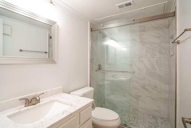 bathroom featuring toilet, ornamental molding, vanity, and walk in shower