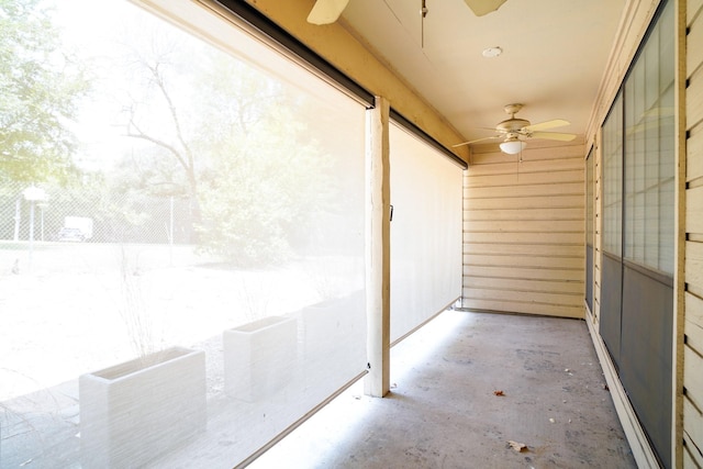 balcony with a patio and ceiling fan